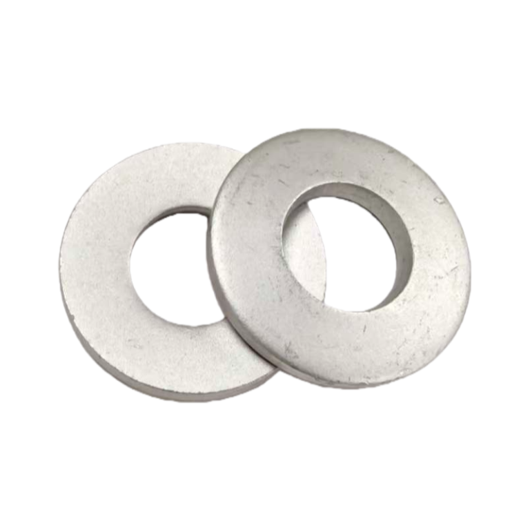 Stacked view of multiple Dacromet coated DIN 6796 washers for industrial supply.
